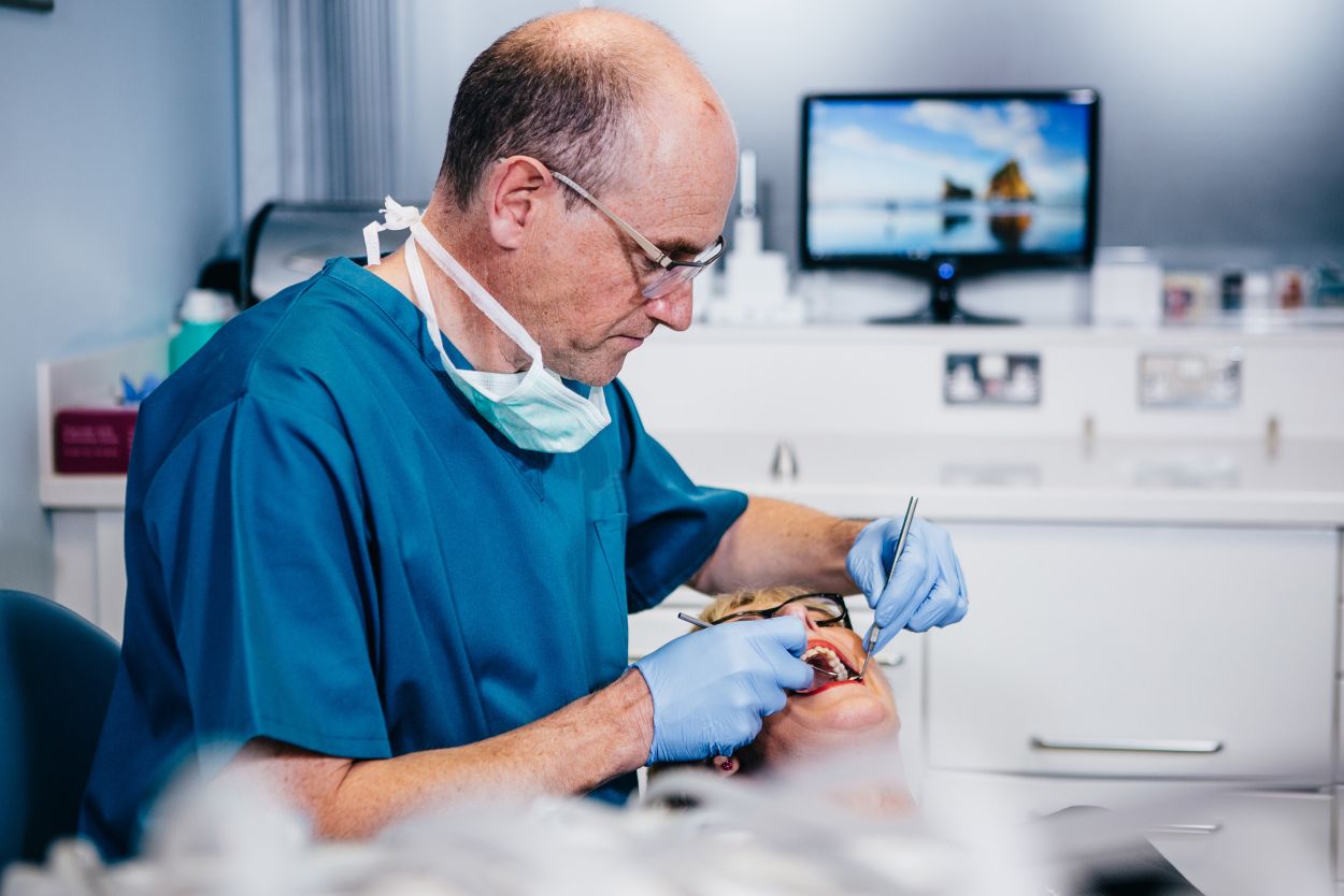 Dentist with veneer patient, making a dream smile