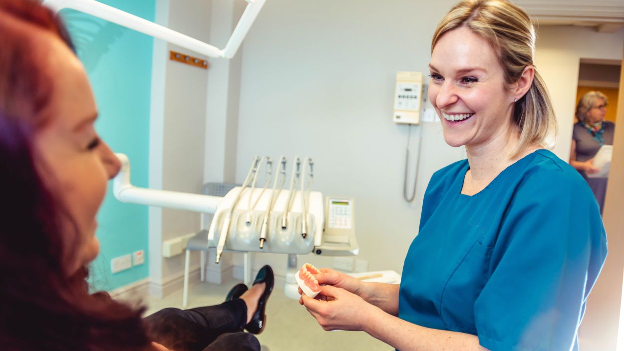 Happy patient smiling after All-on-4 procedure
