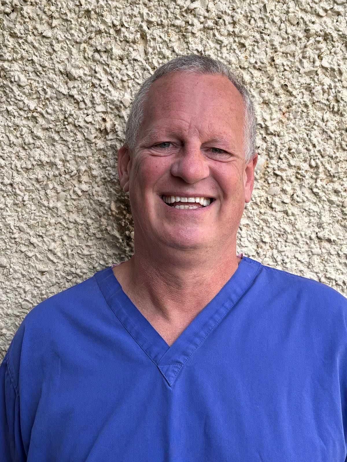 Patient smiling after implant procedure