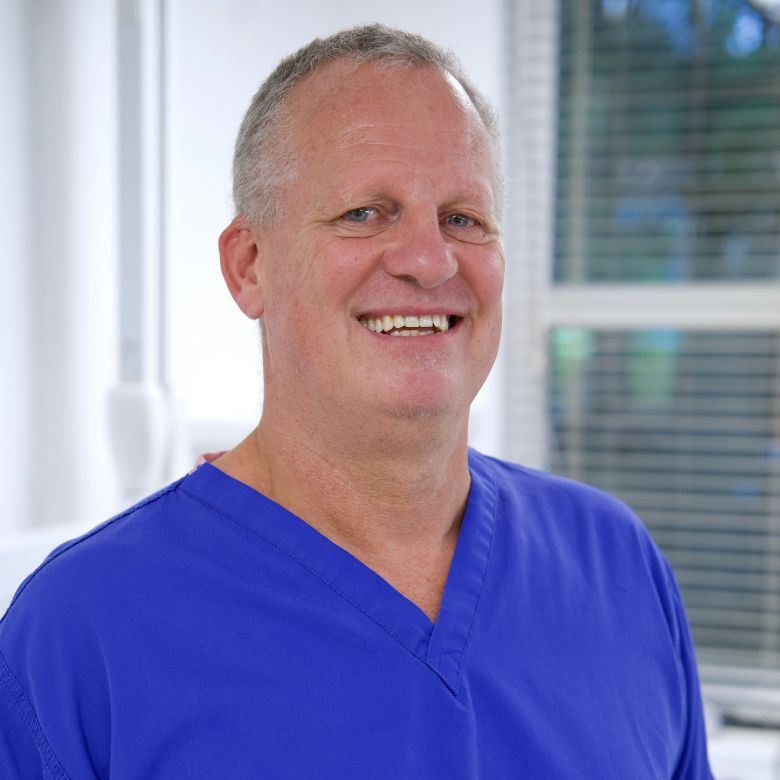 Happy patient smiling after All-on-4 procedure