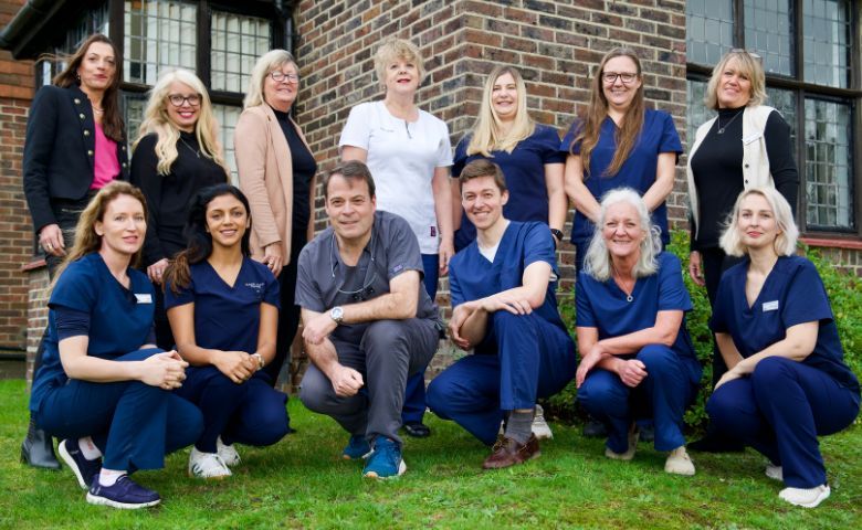 Friendly dentist supporting nervous patient